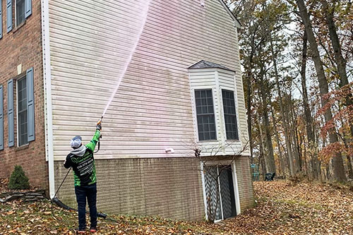 Power/Pressure Washing Siding on a Residential Home Before